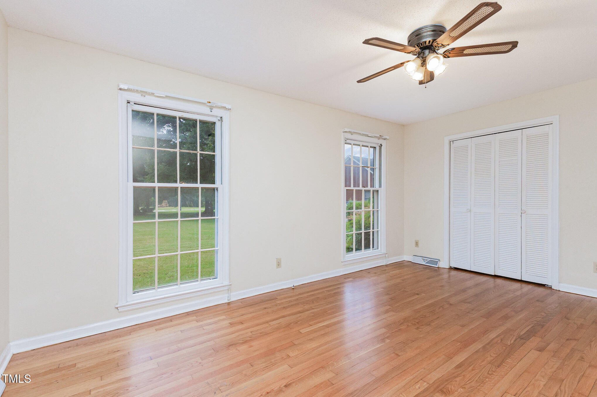 316 Cheeks Lane Graham, NC 27253 - Photo 33 of 52 wooden floor in an empty room with a window
