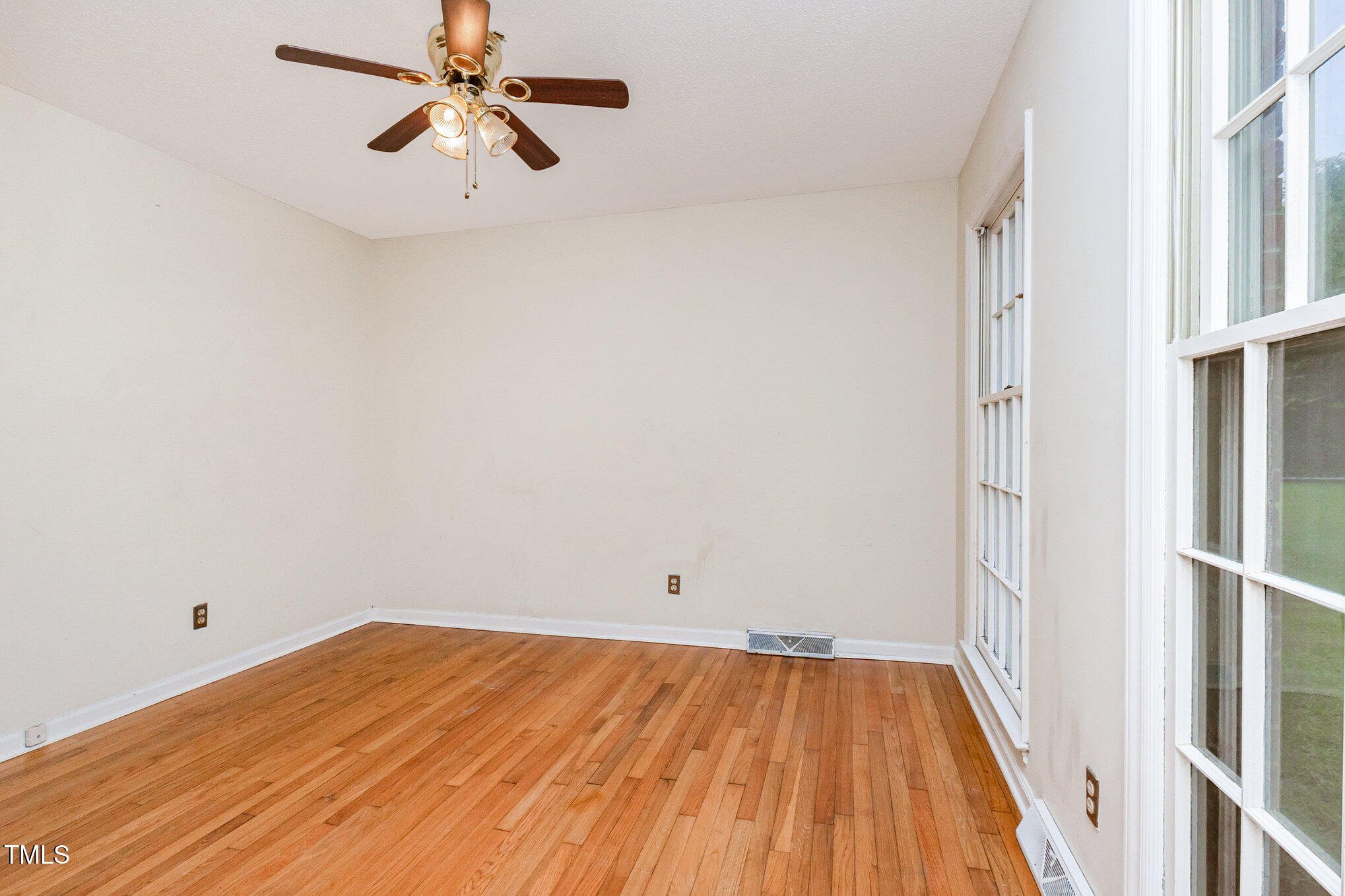 316 Cheeks Lane Graham, NC 27253 - Photo 35 of 52 a view of room with hardwood floor and a ceiling fan