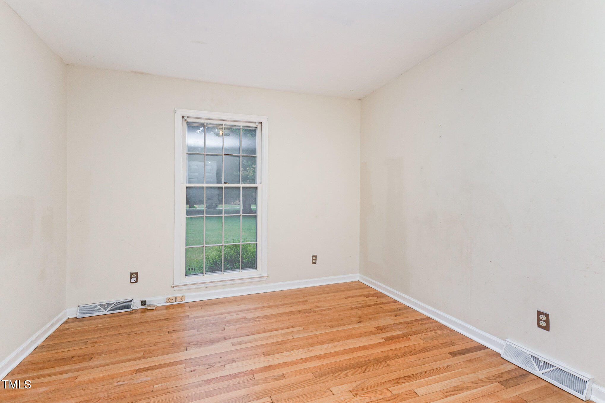 316 Cheeks Lane Graham, NC 27253 - Photo 38 of 52 a view of empty room with wooden floor and fan