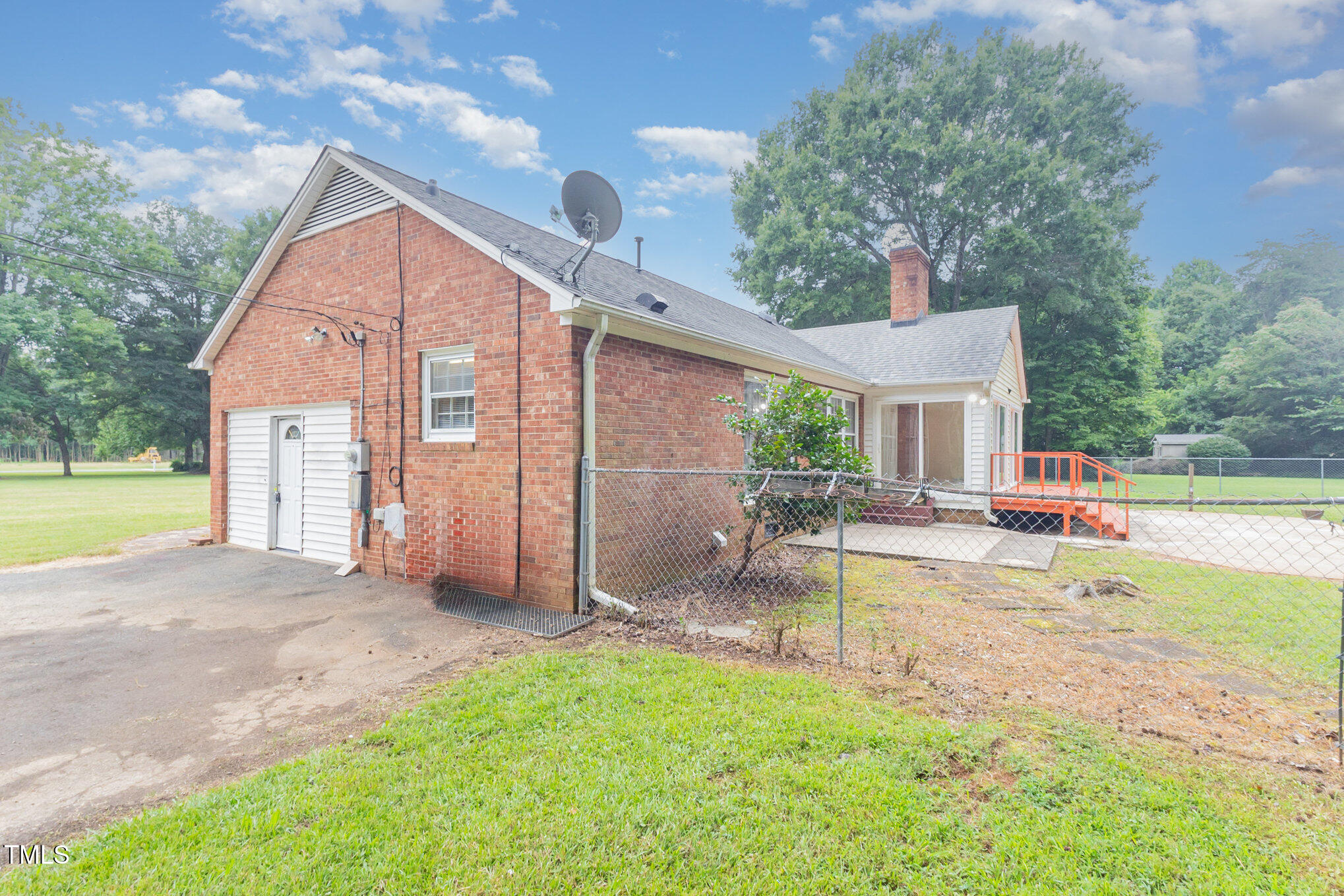 316 Cheeks Lane Graham, NC 27253 - Photo 41 of 52 a view of a house with backyard and a tree
