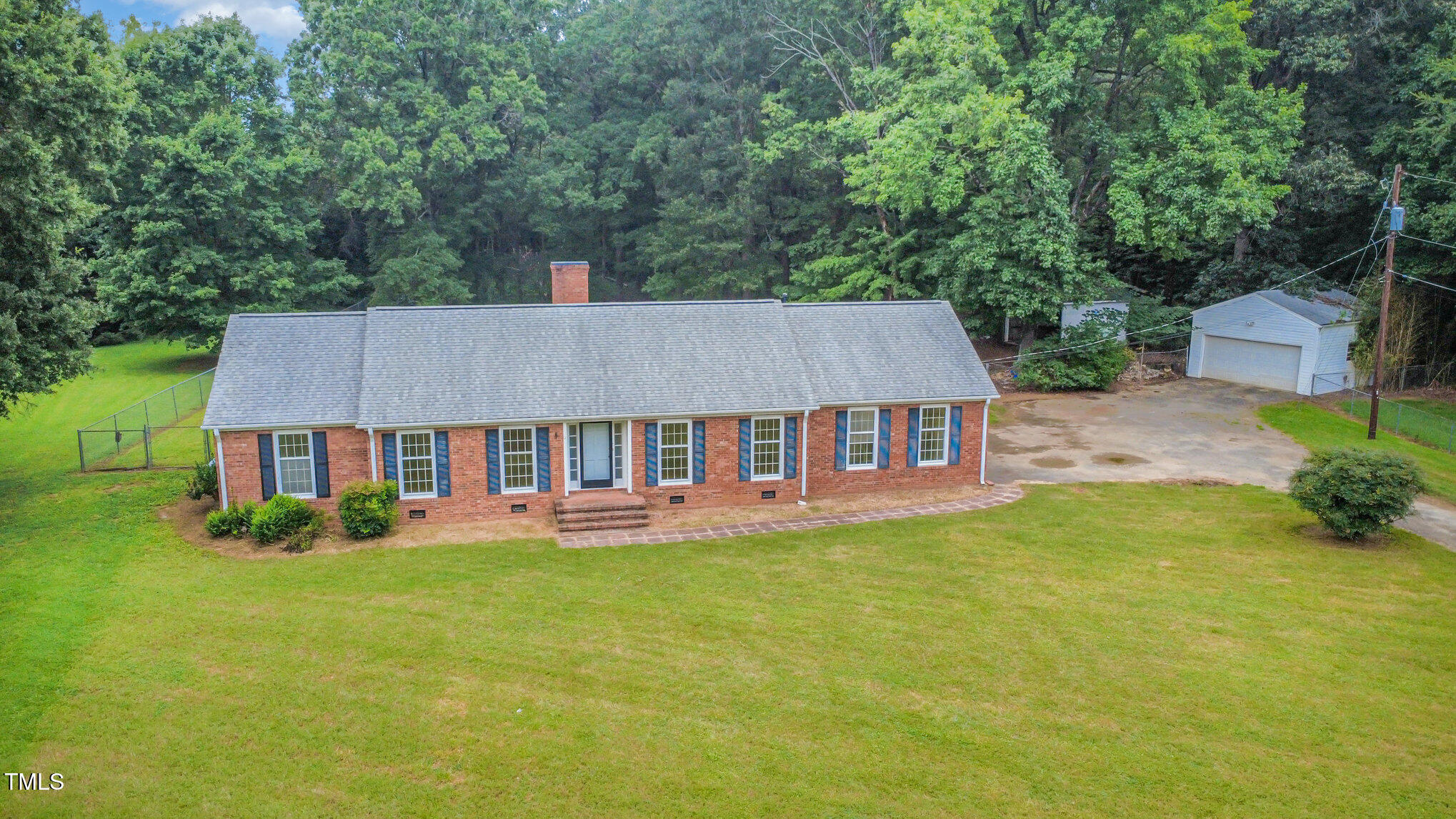 316 Cheeks Lane Graham, NC 27253 - Photo 46 of 52 front view of a house with a garden