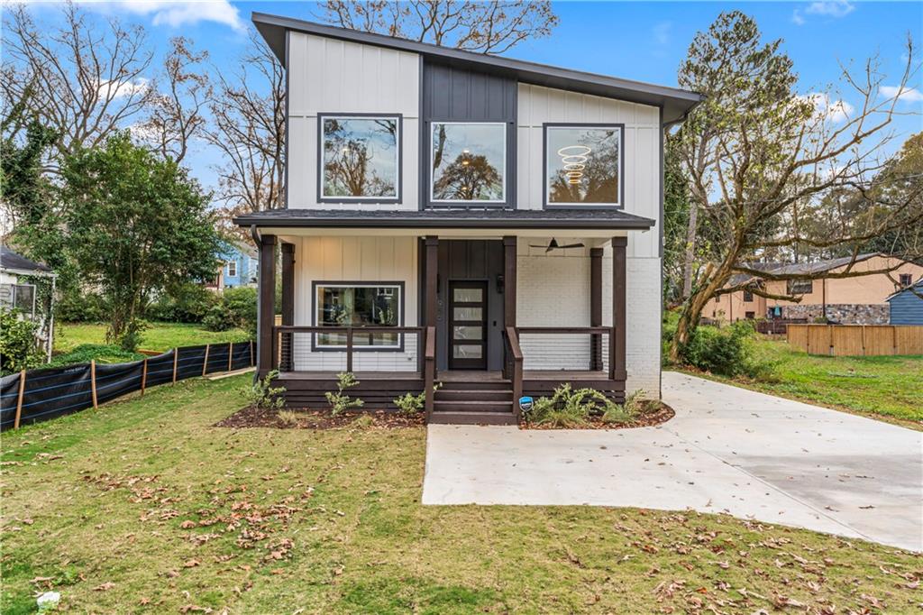 1956 Baker Road Northwest Atlanta, GA 30318 - Photo 1 of 1 a front view of a house with garden
