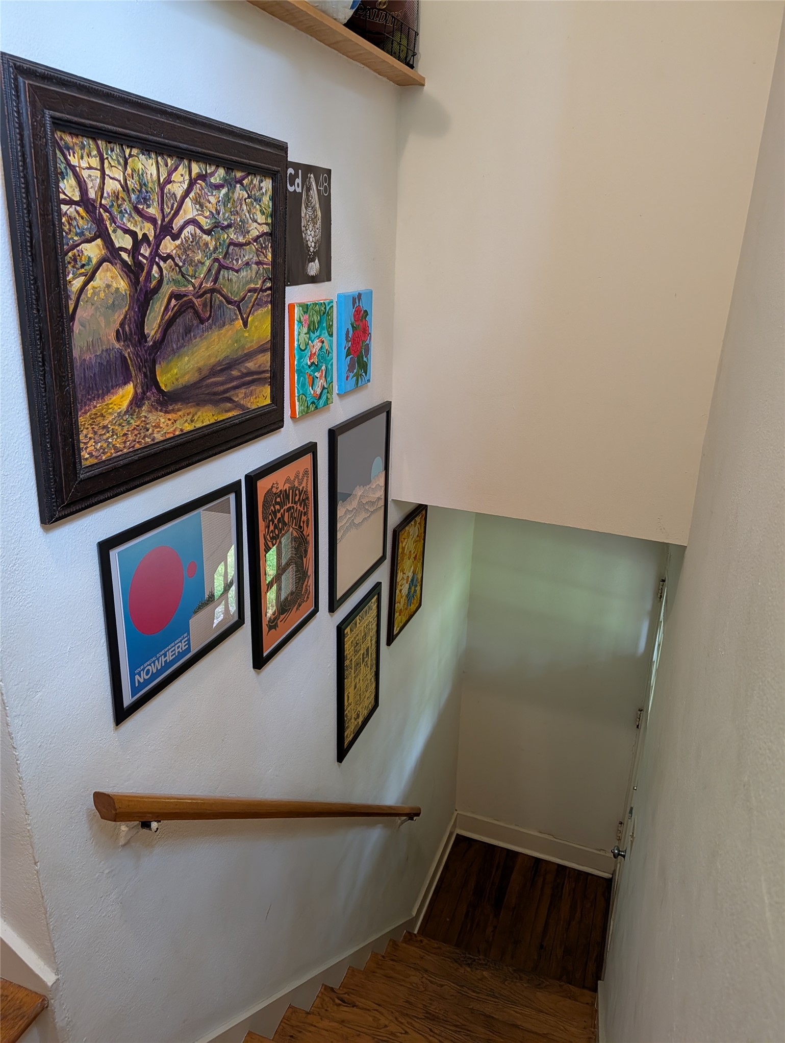 1302 Kirkwood Road, Unit B Austin, TX 78722 - Photo 2 of 12 Hardwood staircase with a solid wood handrail