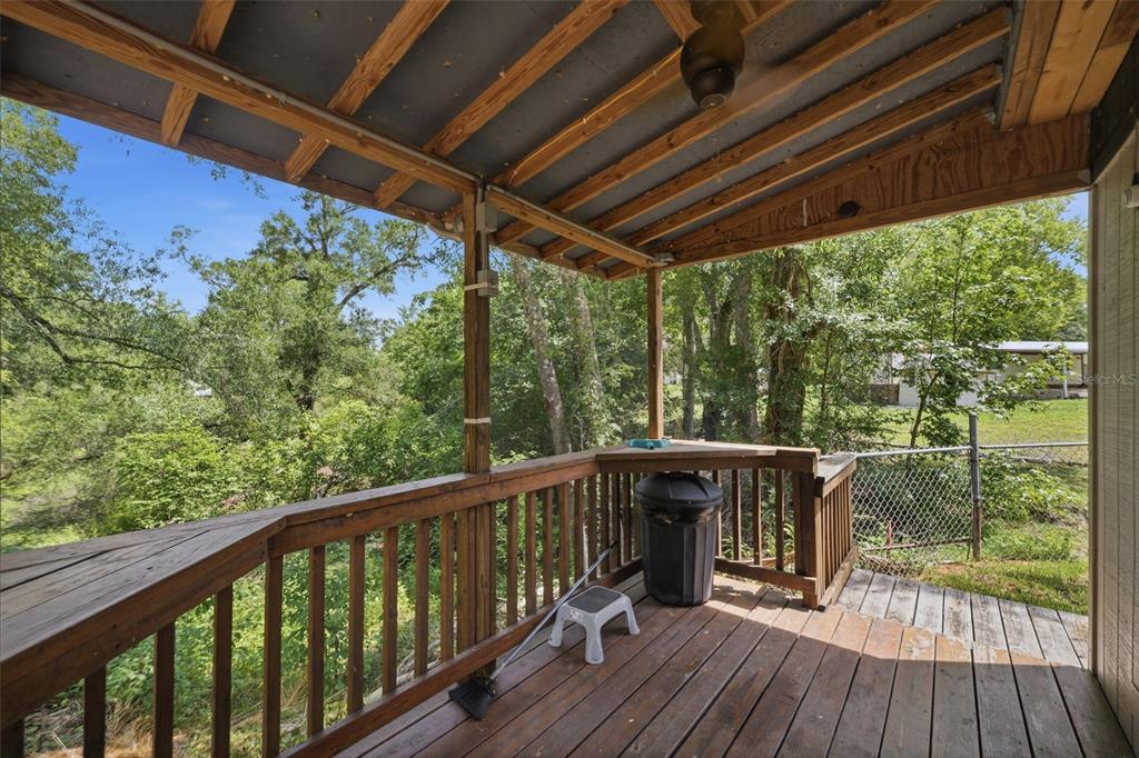 3183 Cedley Road Dade City, FL 33523 - Photo 26 of 48 a view of a balcony with wooden floor