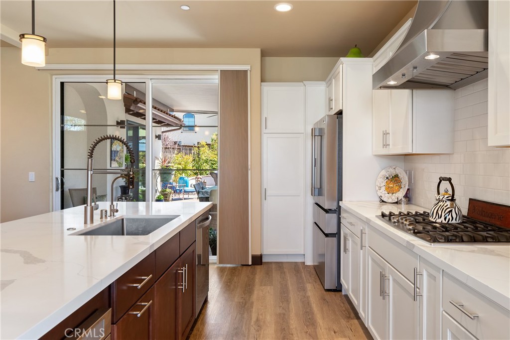 9300 Via Castillo Atascadero, CA 93422 - Photo 13 of 49 a kitchen with stainless steel appliances a sink stove and refrigerator