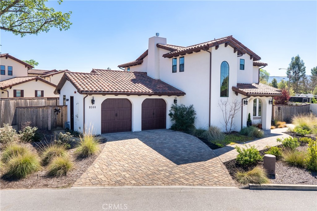 9300 Via Castillo Atascadero, CA 93422 - Photo 2 of 49 a front view of a house with a yard and garage