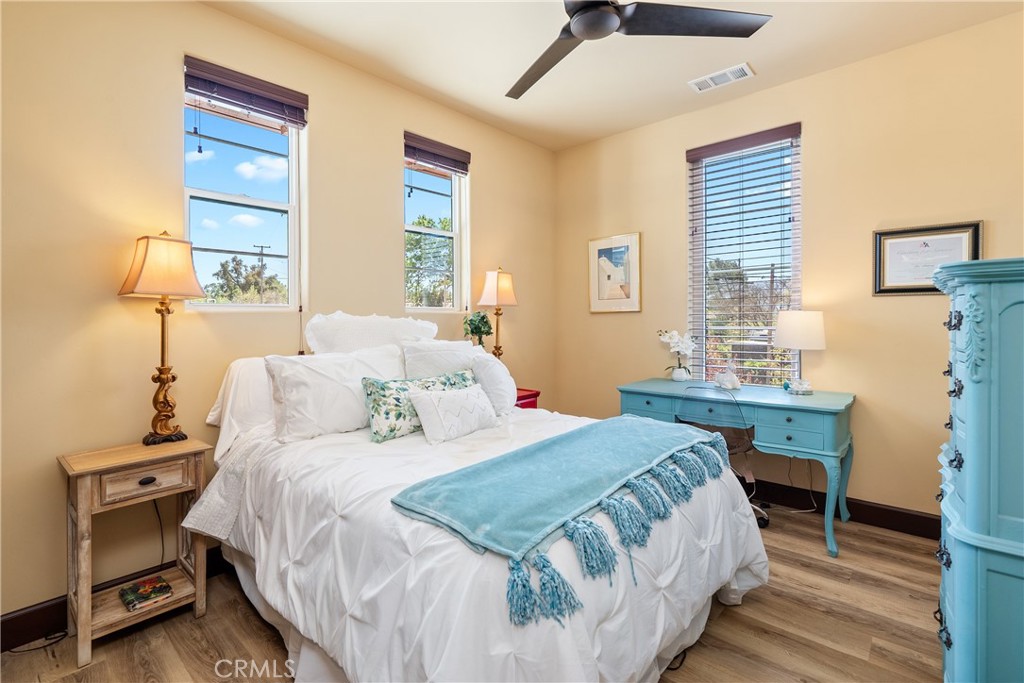 9300 Via Castillo Atascadero, CA 93422 - Photo 26 of 49 a bedroom with a bed a table and chair