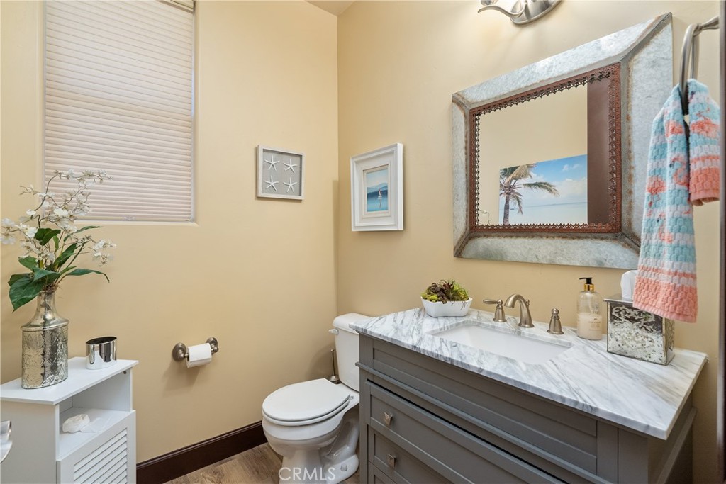 9300 Via Castillo Atascadero, CA 93422 - Photo 28 of 49 a bathroom with a granite countertop toilet sink and mirror