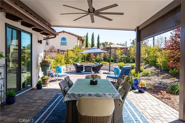 a view of a patio with a table chairs and a patio