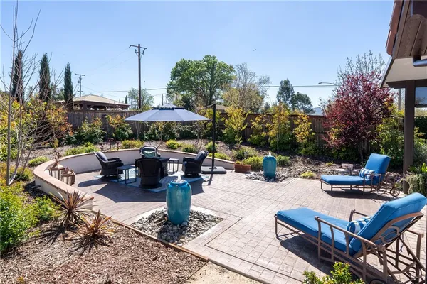 a view of a backyard with sitting area