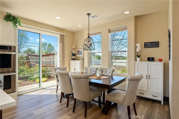 a dining room with furniture window wooden floor