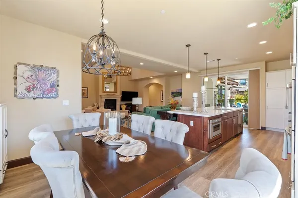 a large living room with dining table