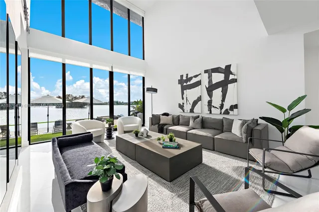 a living room with furniture and a potted plant