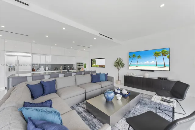 a kitchen with stainless steel appliances a refrigerator and a microwave