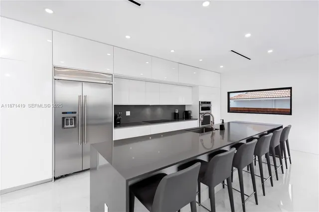 a view of a dining room with furniture and window