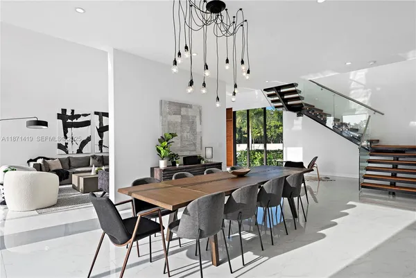 a kitchen with a table and chairs in it