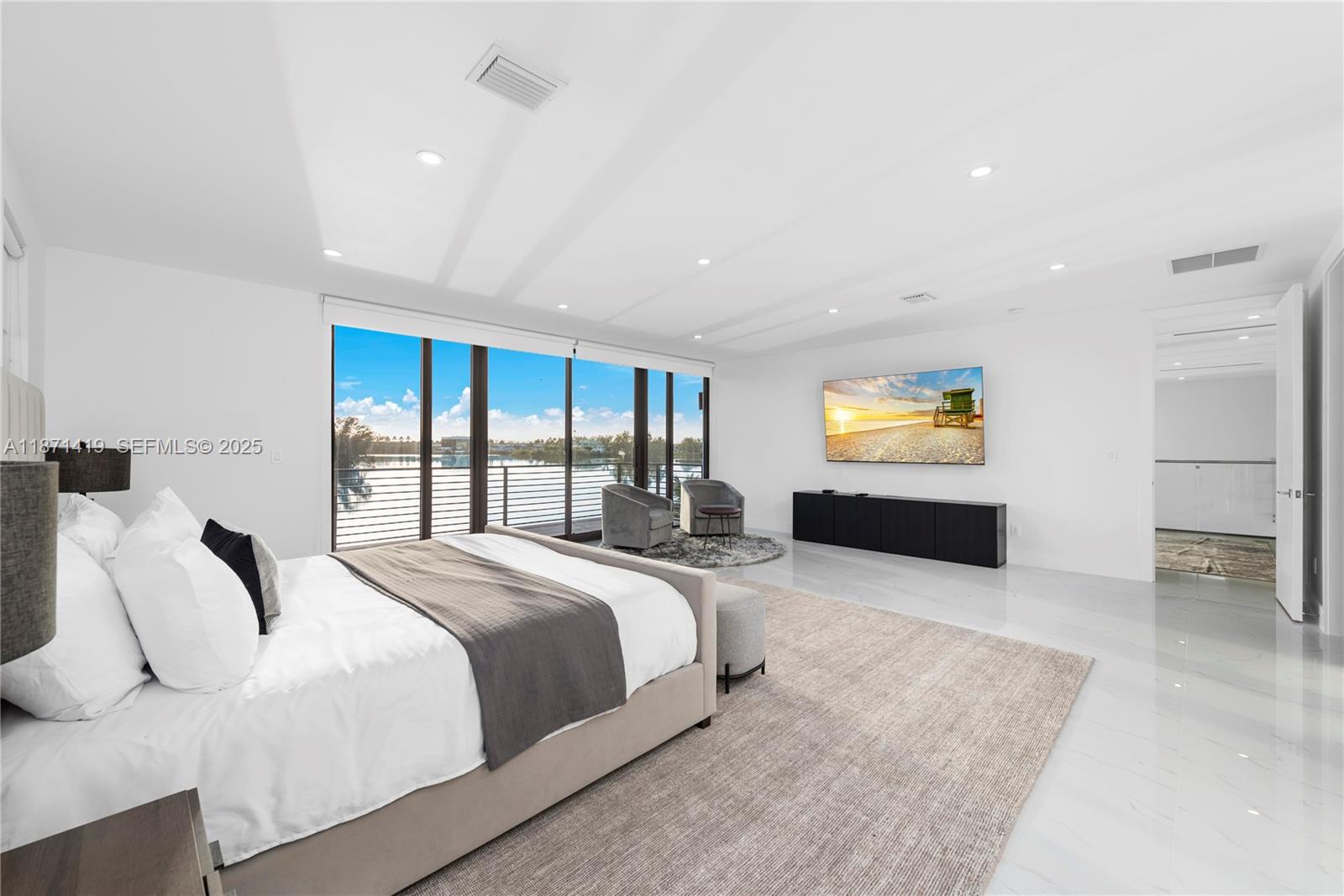 5420 Southwest 72nd Avenue Miami, FL 33155 - Photo 26 of 52 a spacious bedroom with a bed and a dresser