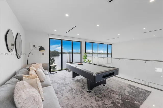 a view of a living room and kitchen