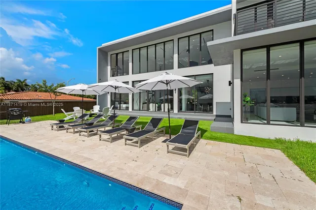 a view of a table and chairs in the garden