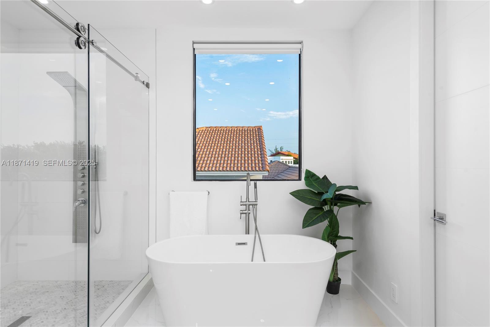 5420 Southwest 72nd Avenue Miami, FL 33155 - Photo 40 of 52 a white bath tub sitting next to a white sink