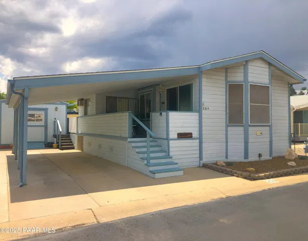 a view of a house with a street