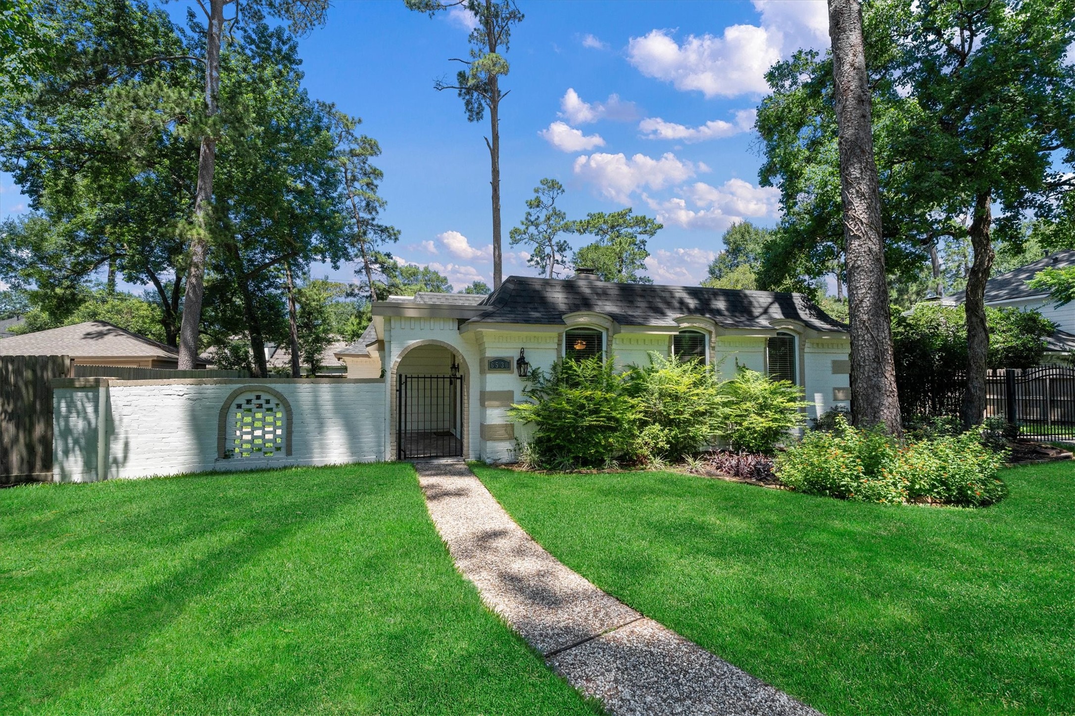 6530 Bayonne Drive Spring, TX 77389 - Photo 35 of 37 a view of a house with a big yard plants and large trees