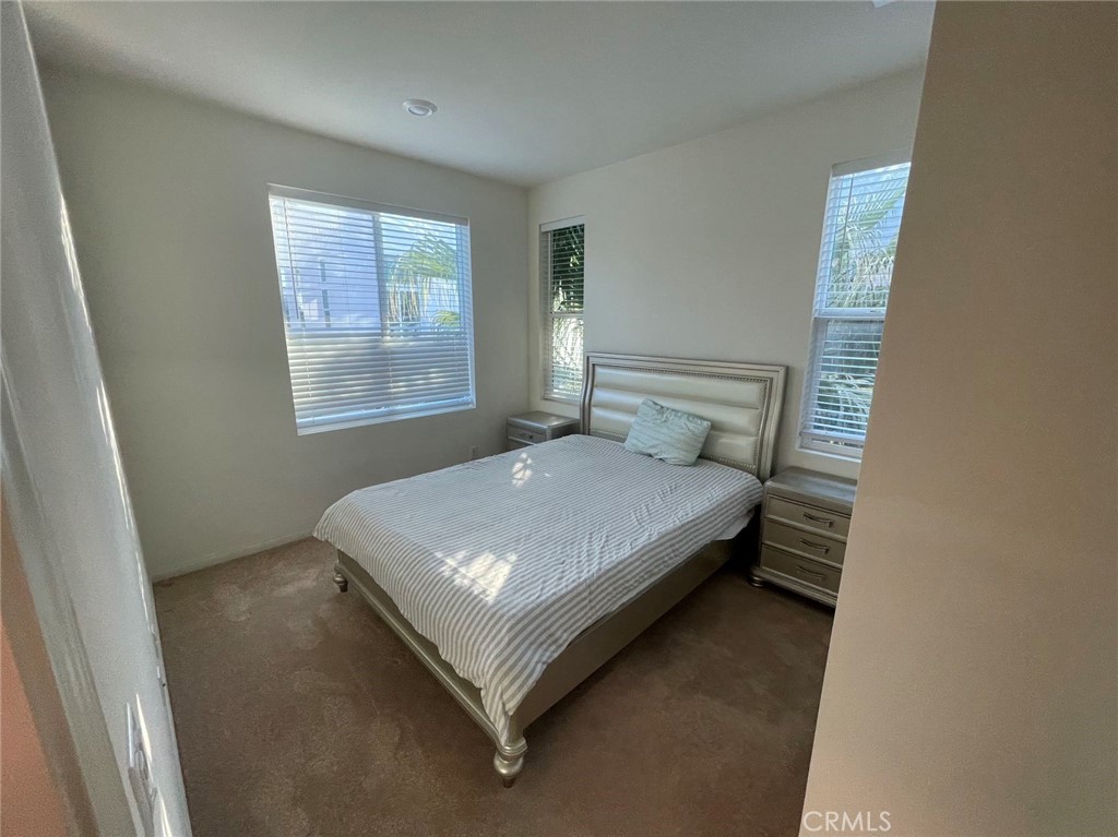 136 Unity Irvine, CA 92614 - Photo 13 of 15 a bed sitting in a bedroom next to a window