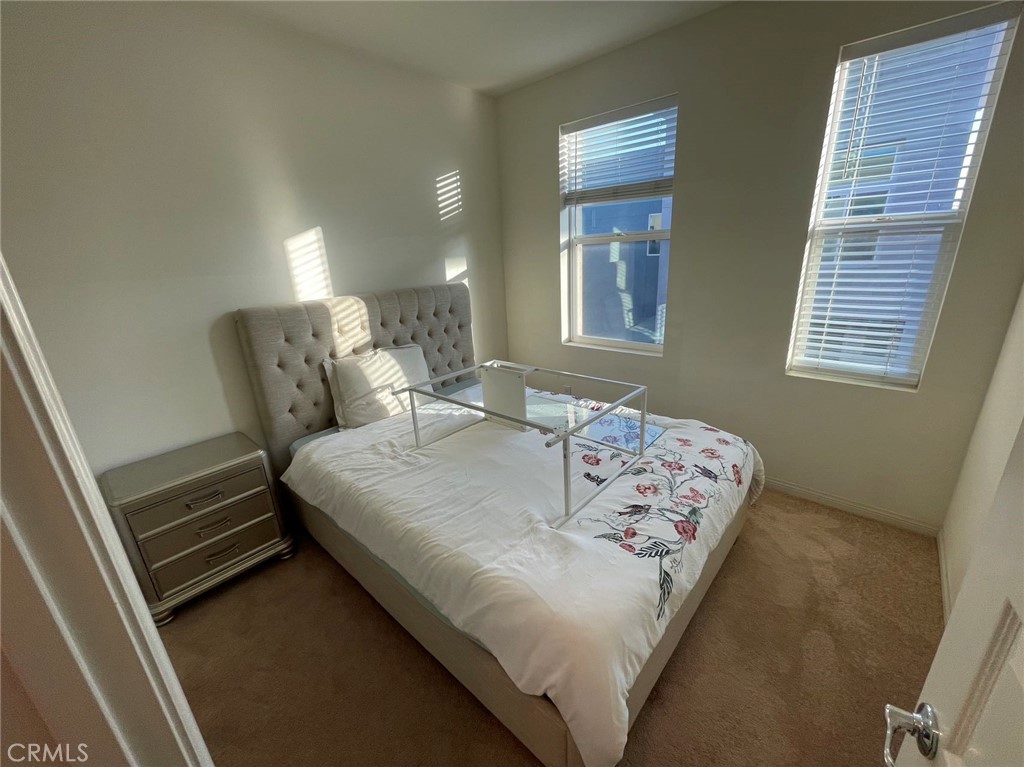 136 Unity Irvine, CA 92614 - Photo 14 of 15 a bedroom with a bed and window