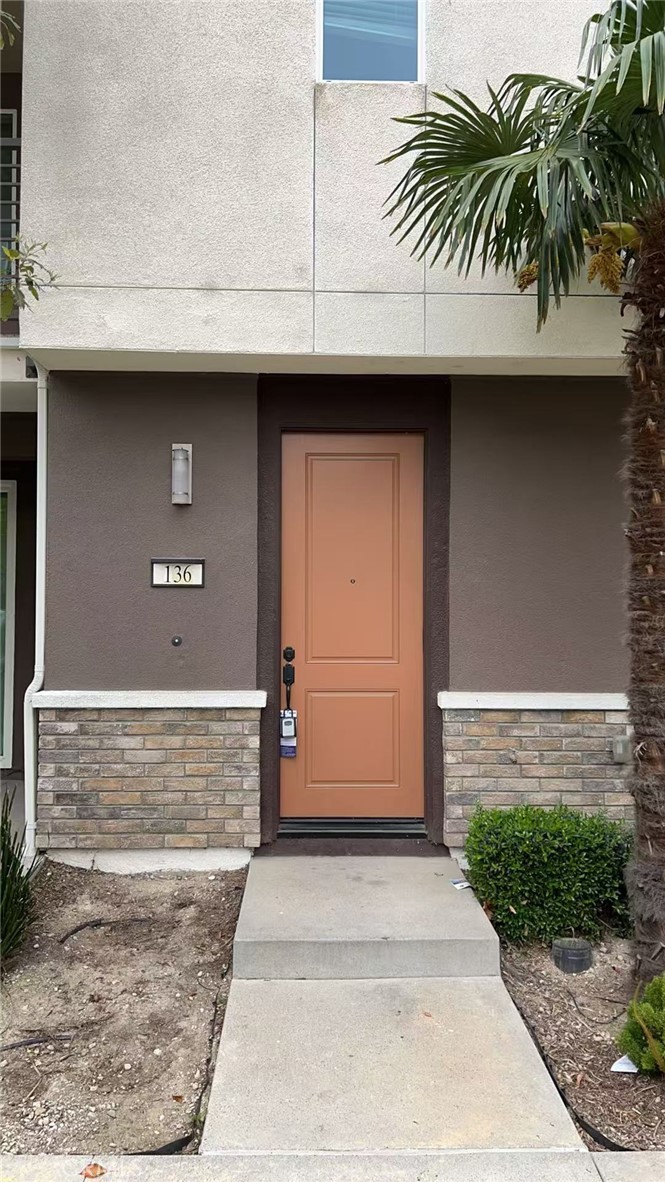 136 Unity Irvine, CA 92614 - Photo 15 of 15 a front view of a house with a yard