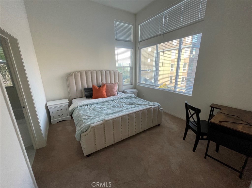 136 Unity Irvine, CA 92614 - Photo 8 of 15 a bedroom with a bed chair and a window