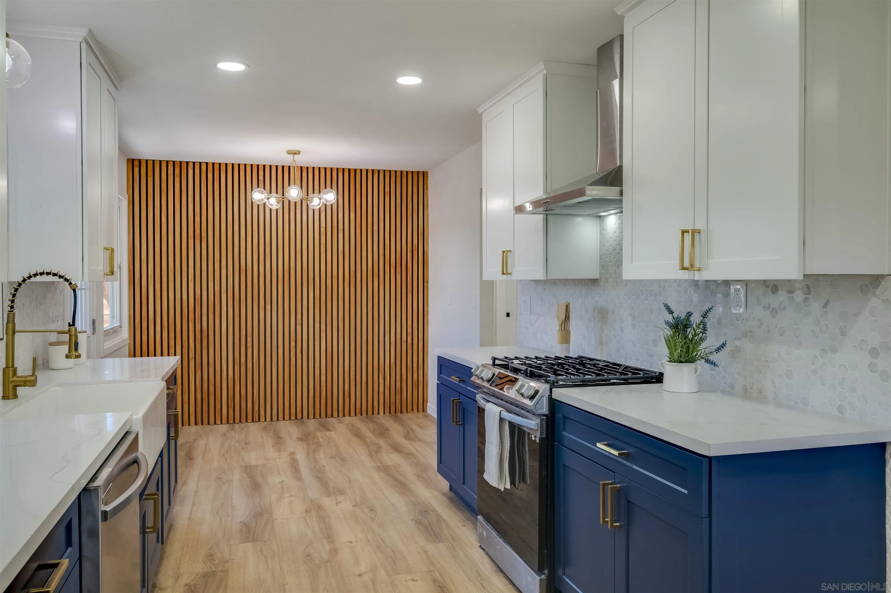 4055 Mt Albertine Avenue San Diego, CA 92111 - Photo 11 of 33 a kitchen with kitchen island stainless steel appliances a sink stove and cabinets
