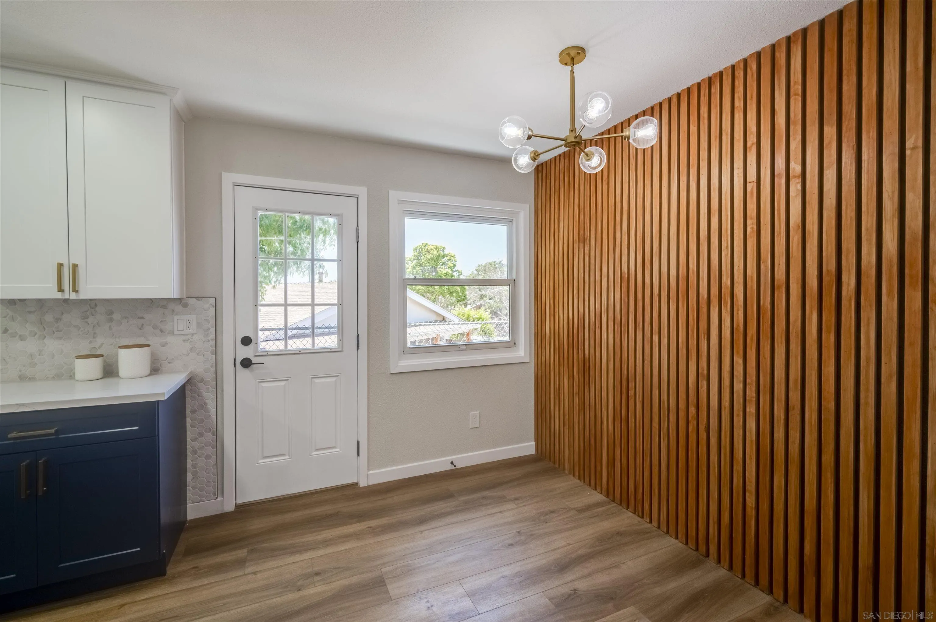4055 Mt Albertine Avenue San Diego, CA 92111 - Photo 12 of 33 wooden floor in an empty room with a window