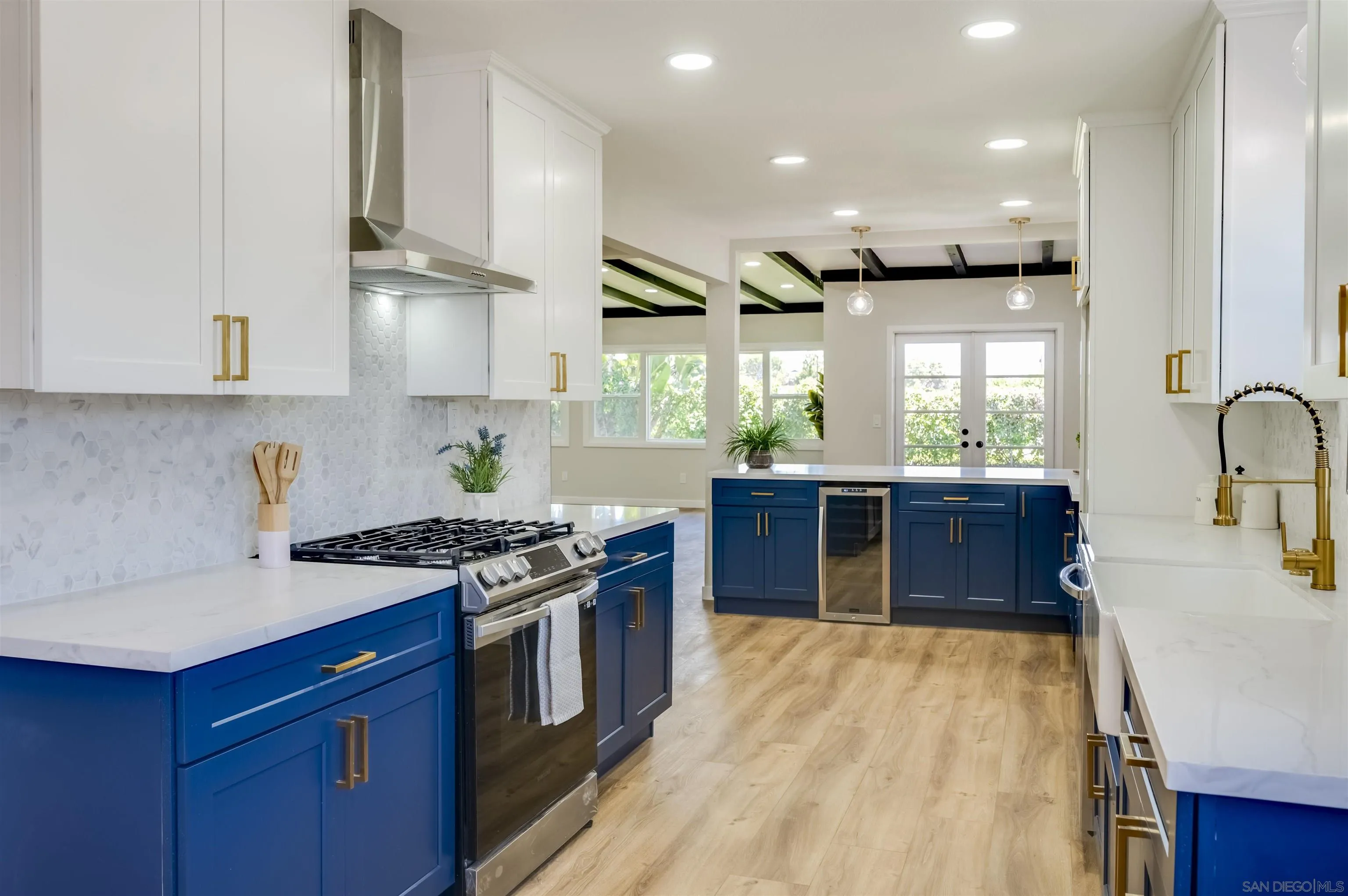 4055 Mt Albertine Avenue San Diego, CA 92111 - Photo 13 of 33 a kitchen with stainless steel appliances granite countertop wooden cabinets sink and stove