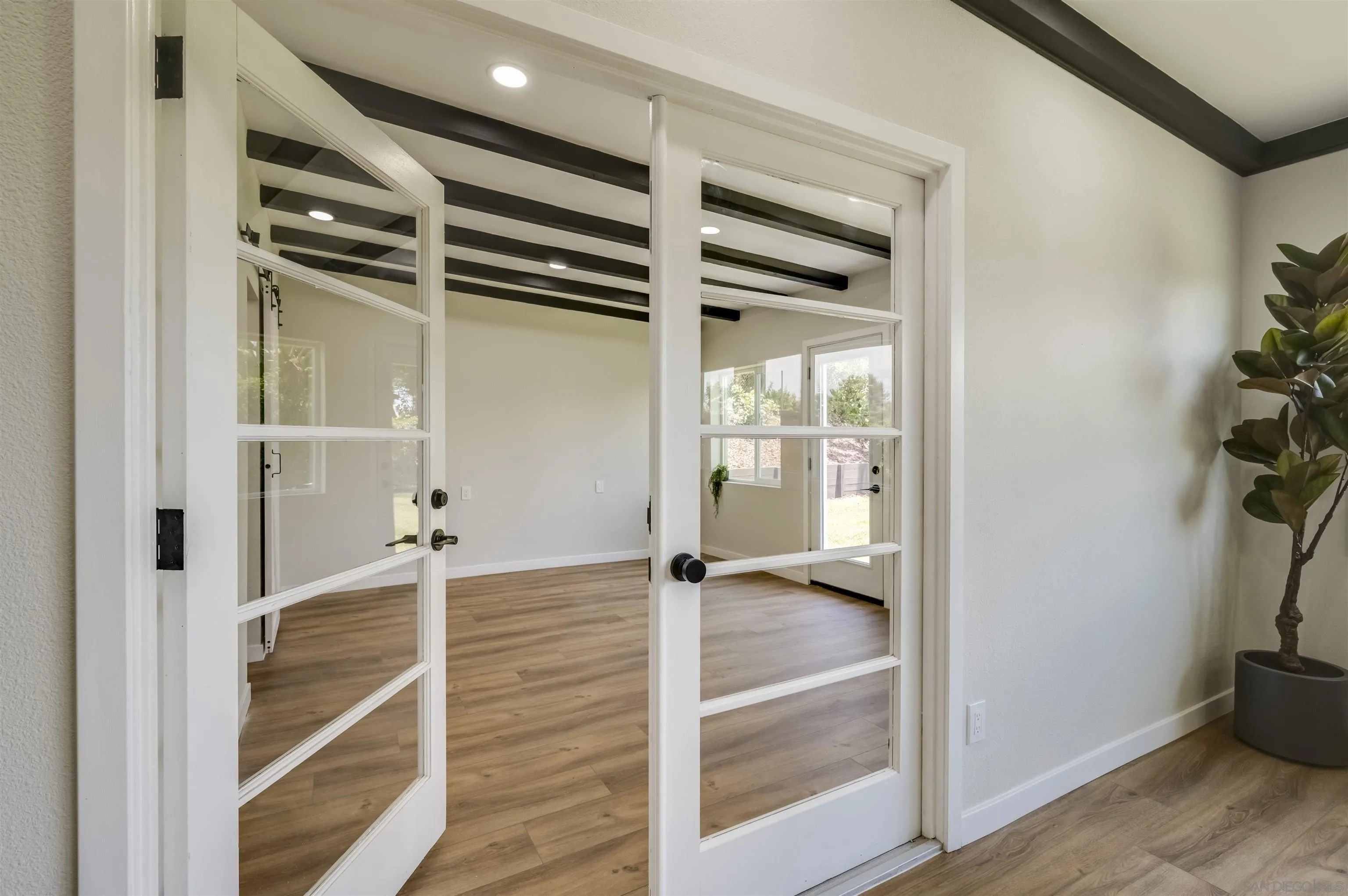 4055 Mt Albertine Avenue San Diego, CA 92111 - Photo 14 of 33 wooden floor and window in an empty room