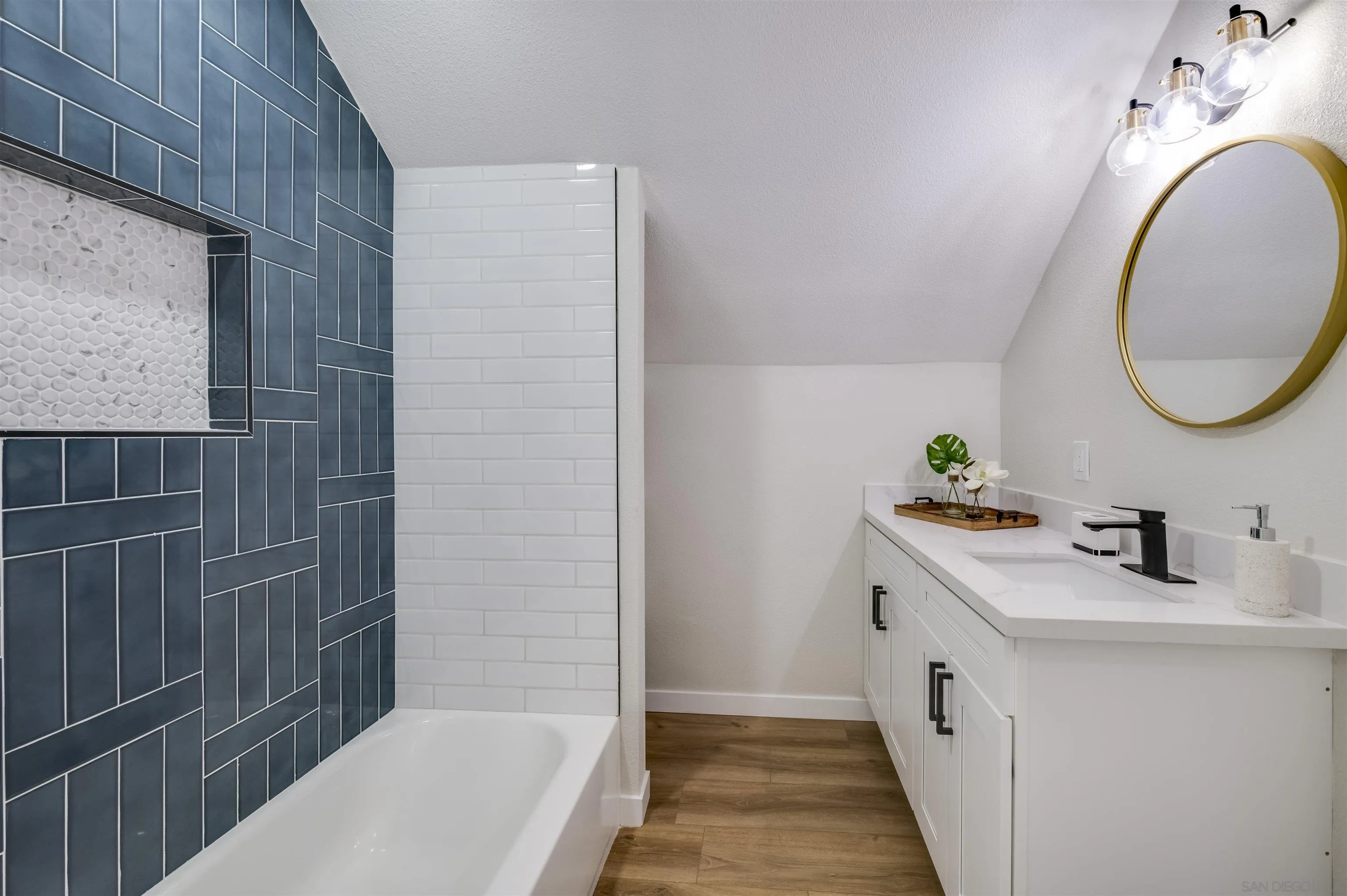 4055 Mt Albertine Avenue San Diego, CA 92111 - Photo 24 of 33 a bathroom with a sink and a mirror