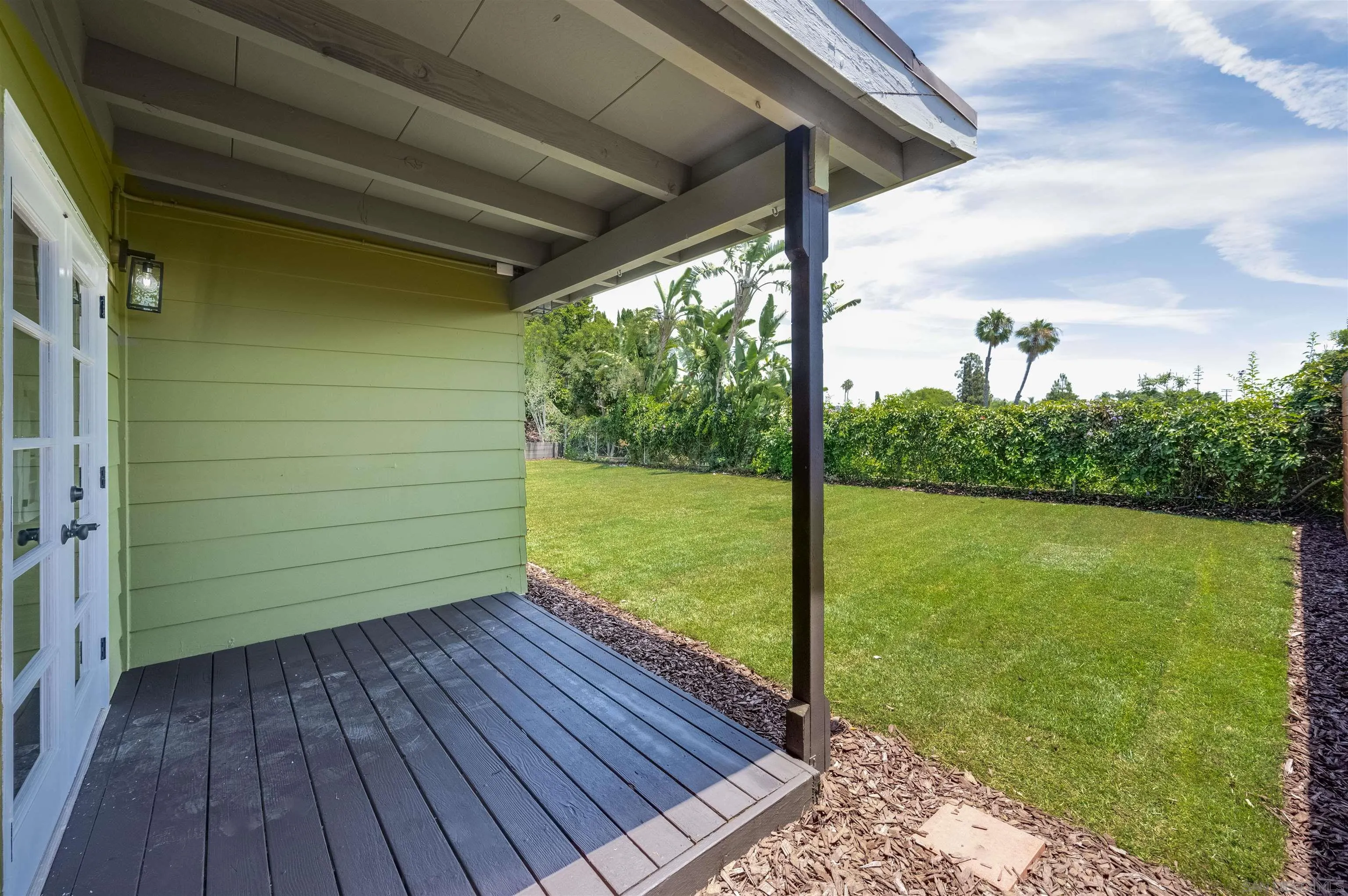 4055 Mt Albertine Avenue San Diego, CA 92111 - Photo 29 of 33 a view of a room with water fountain and wooden floor