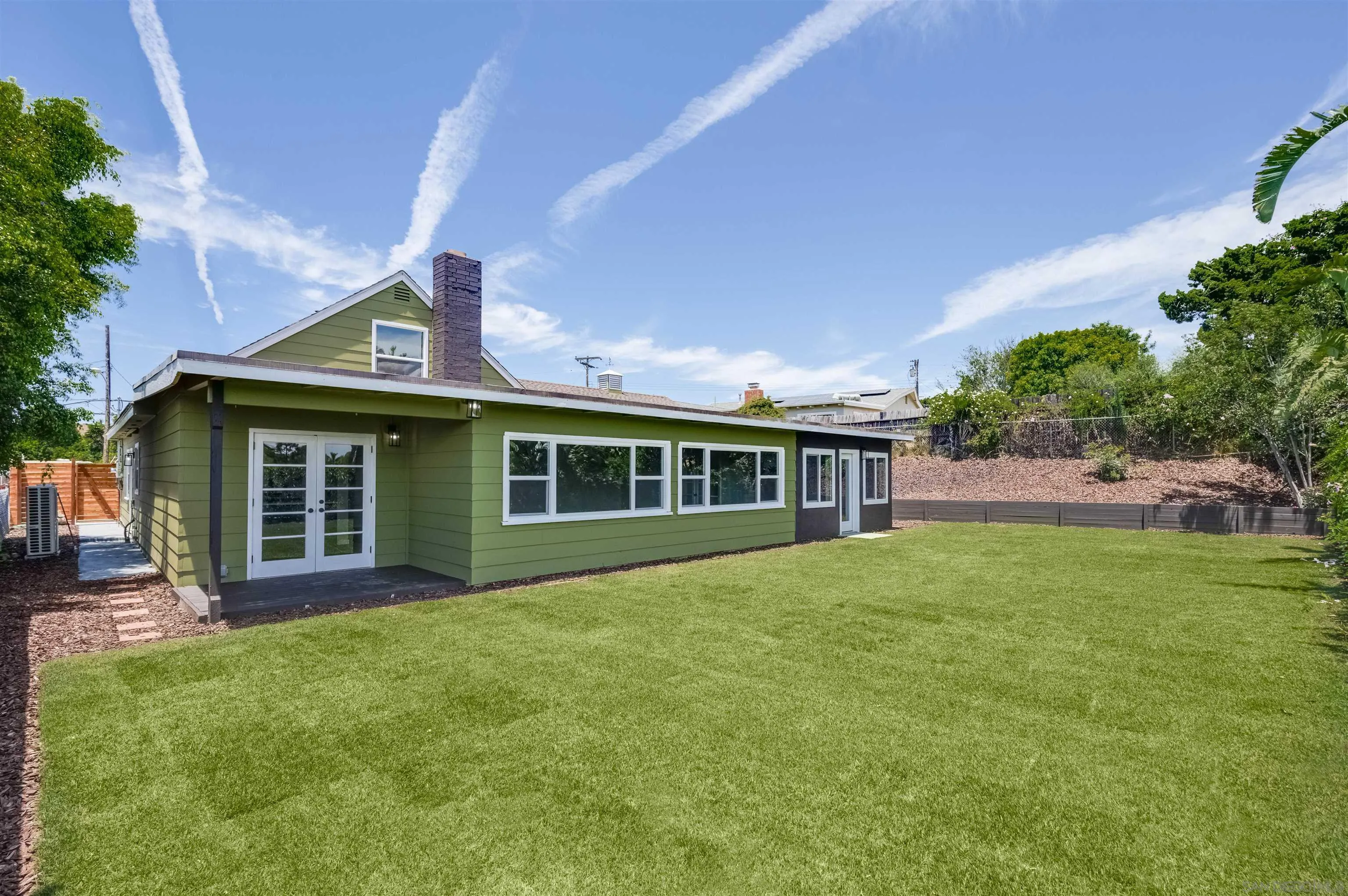 4055 Mt Albertine Avenue San Diego, CA 92111 - Photo 30 of 33 a front view of house with yard and green space