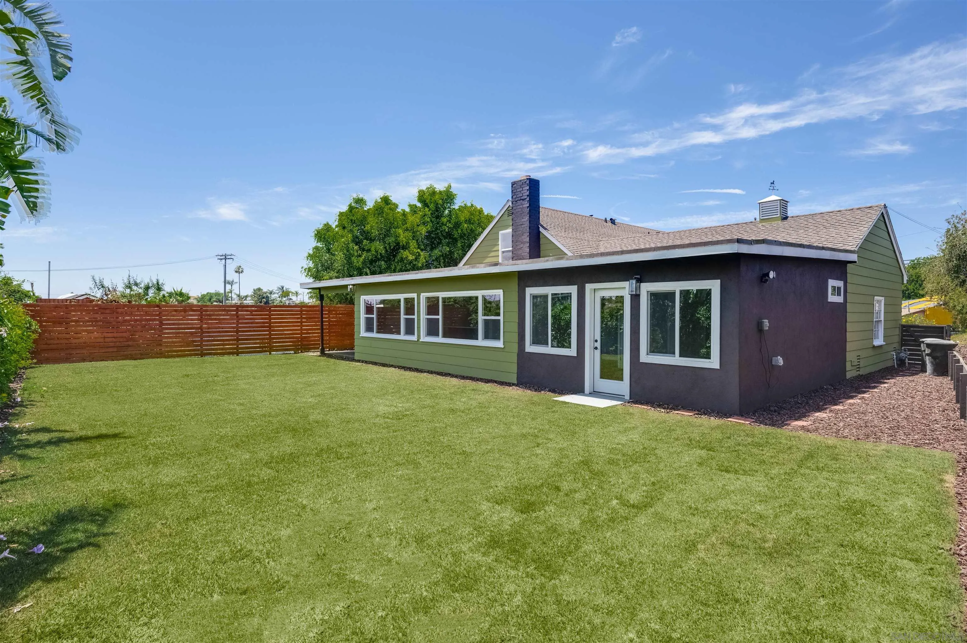 4055 Mt Albertine Avenue San Diego, CA 92111 - Photo 31 of 33 a front view of a house with a garden