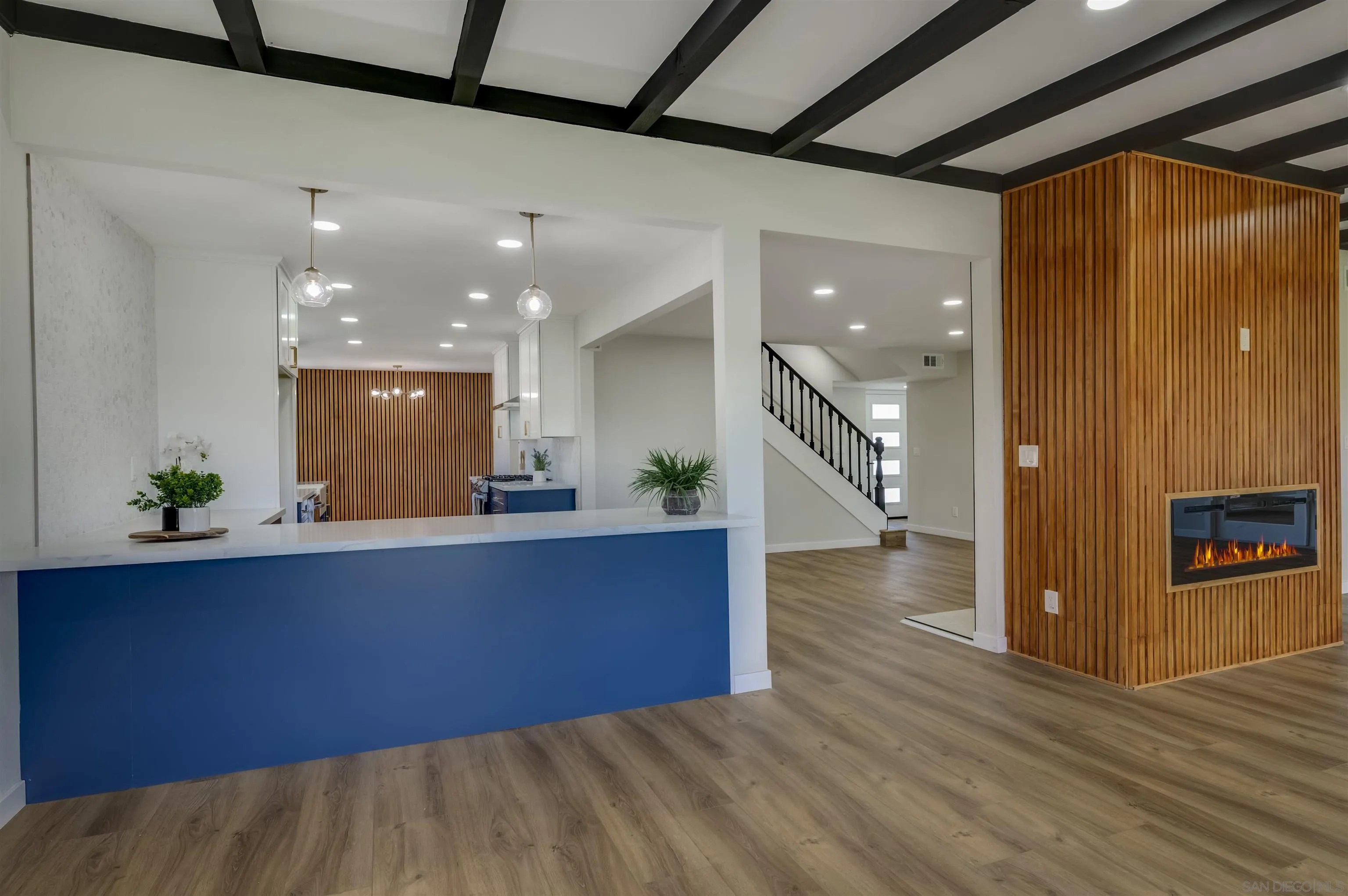 4055 Mt Albertine Avenue San Diego, CA 92111 - Photo 8 of 33 a view of kitchen and hall with wooden floor