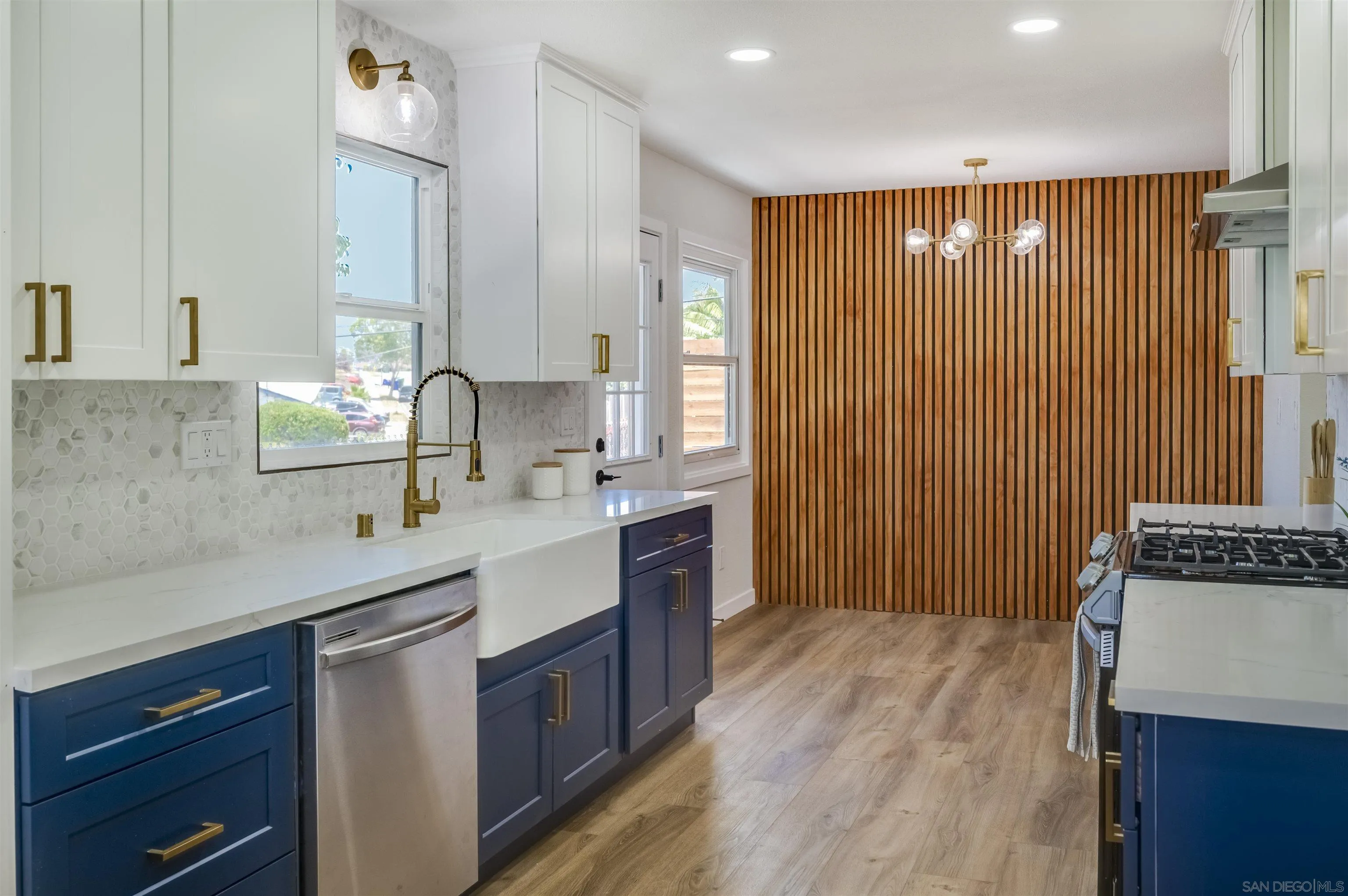 4055 Mt Albertine Avenue San Diego, CA 92111 - Photo 10 of 33 a kitchen with a sink stove and cabinets