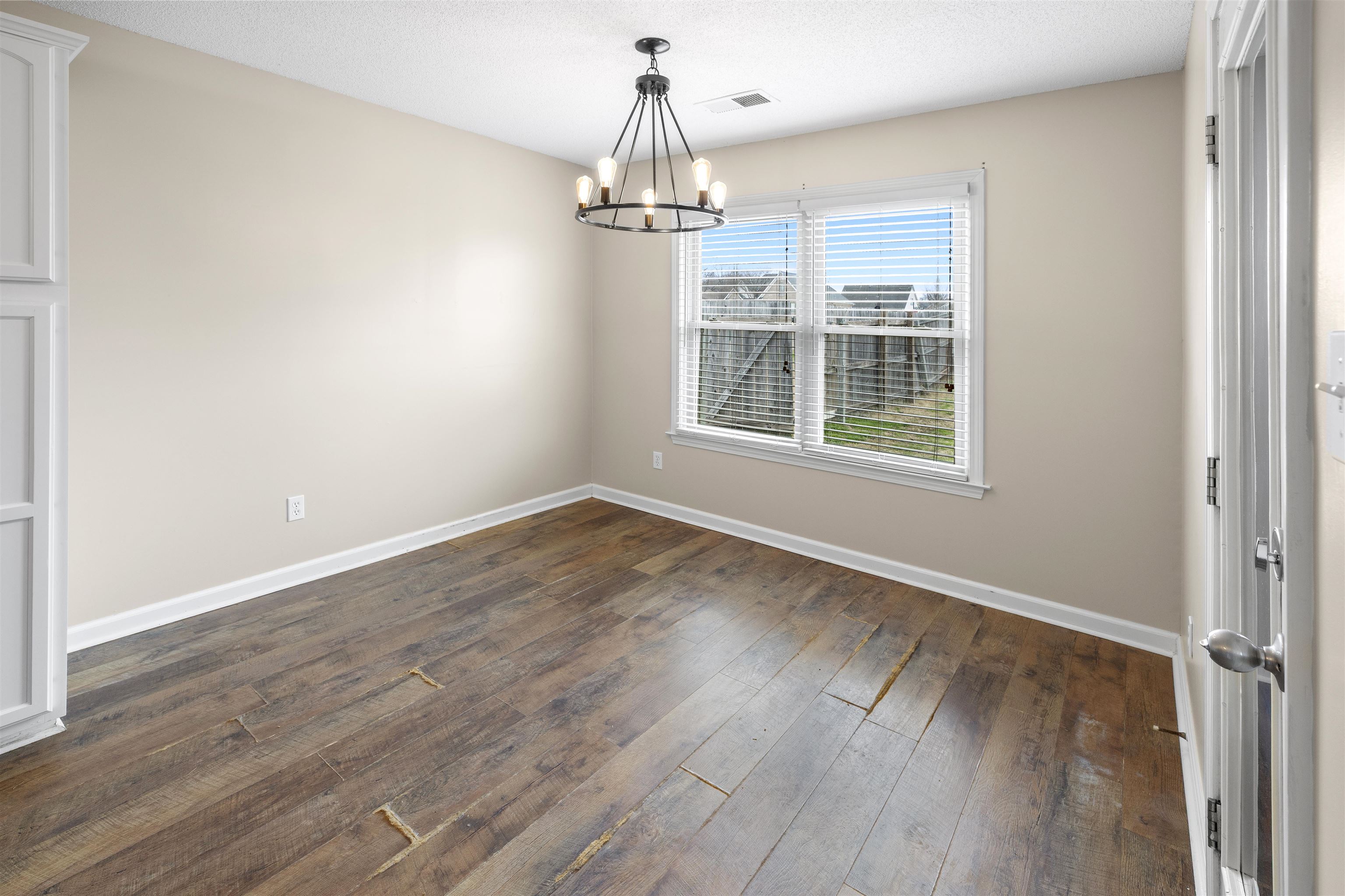 220 Terry Road Somerville, TN 38068 - Photo 13 of 29 wooden floor in an empty room with a window