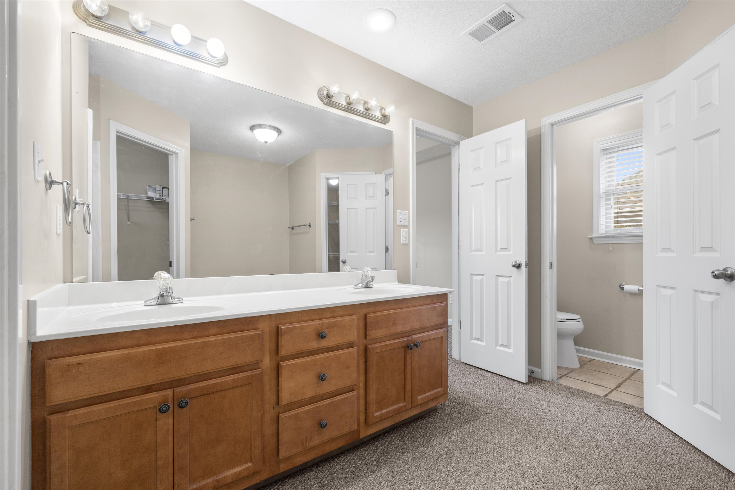 220 Terry Road Somerville, TN 38068 - Photo 17 of 29 a spacious bathroom with a double vanity sink mirror and double