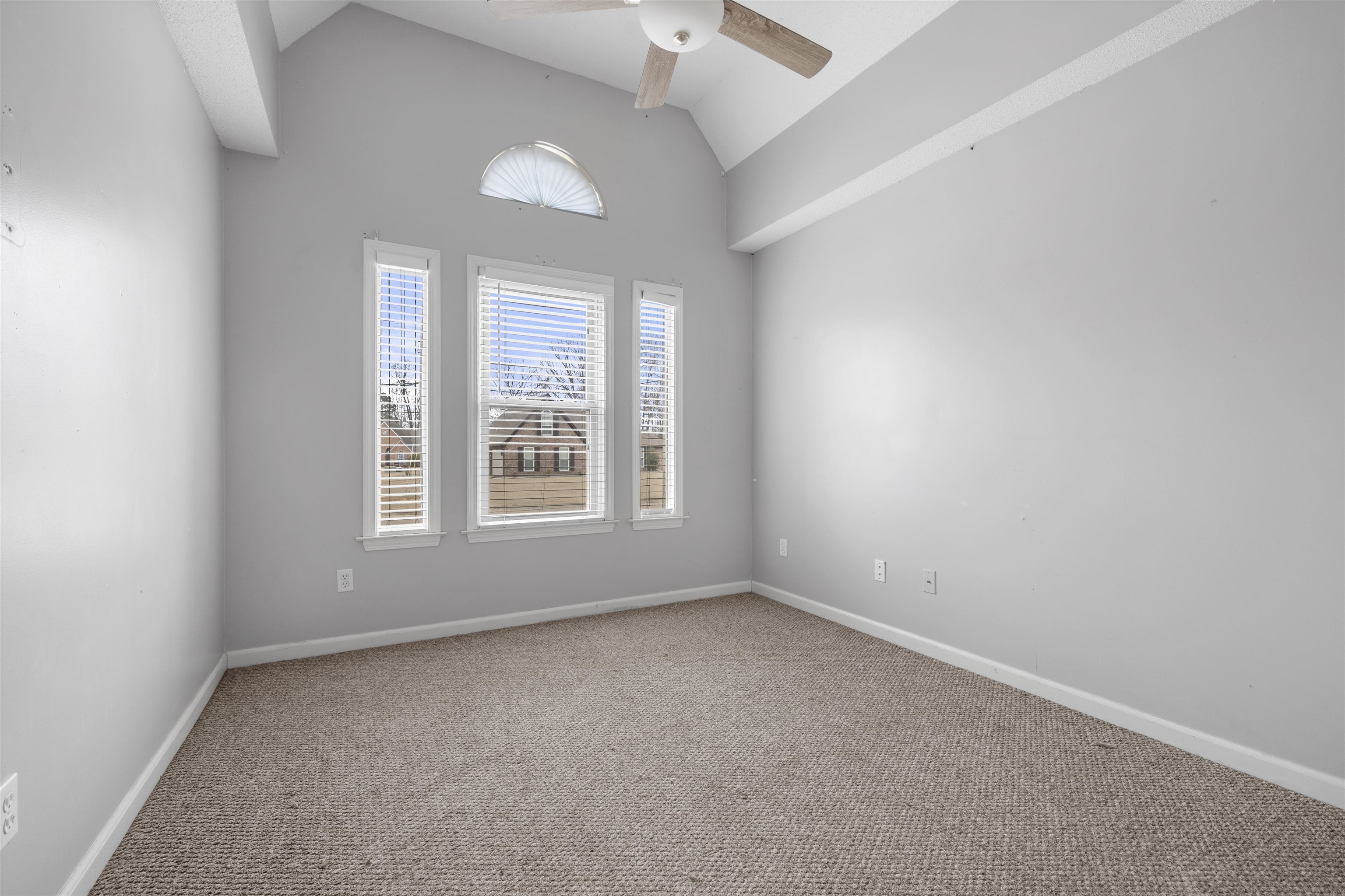 220 Terry Road Somerville, TN 38068 - Photo 23 of 29 an empty room with a window and a ceiling fan
