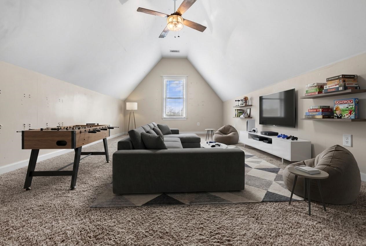 220 Terry Road Somerville, TN 38068 - Photo 26 of 29 a living room with furniture a flat screen tv and a window