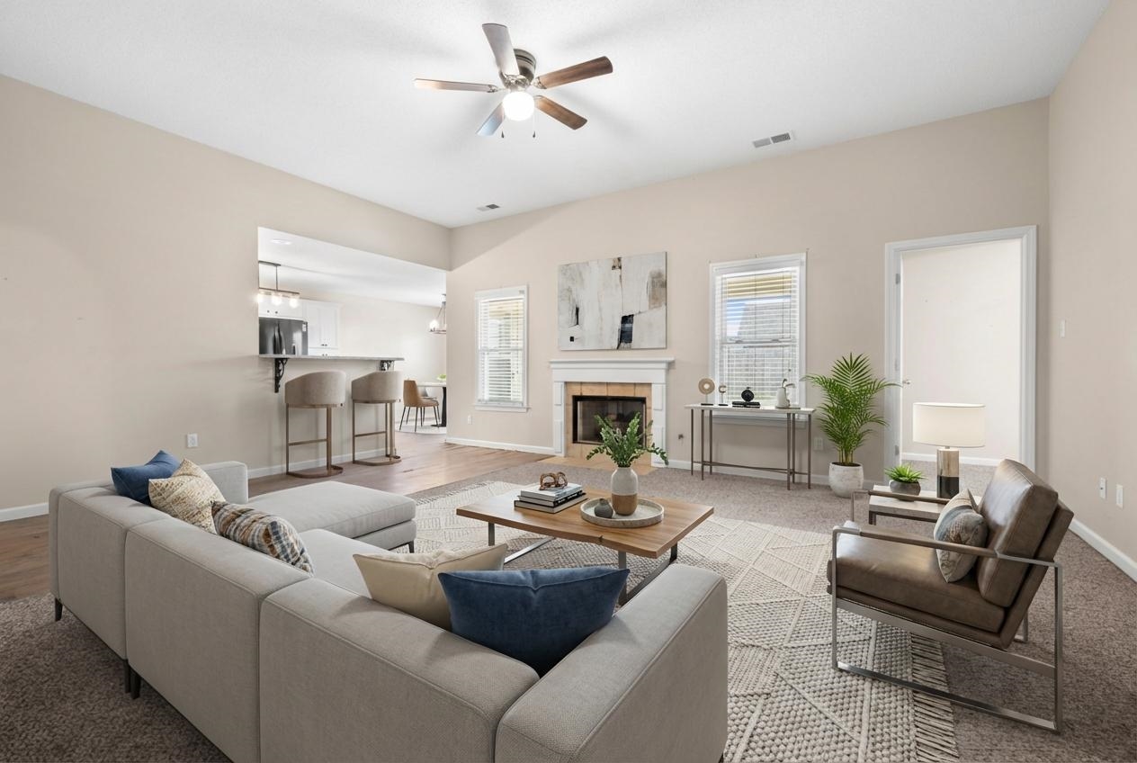 220 Terry Road Somerville, TN 38068 - Photo 8 of 29 a living room with furniture a fireplace and a ceiling fan