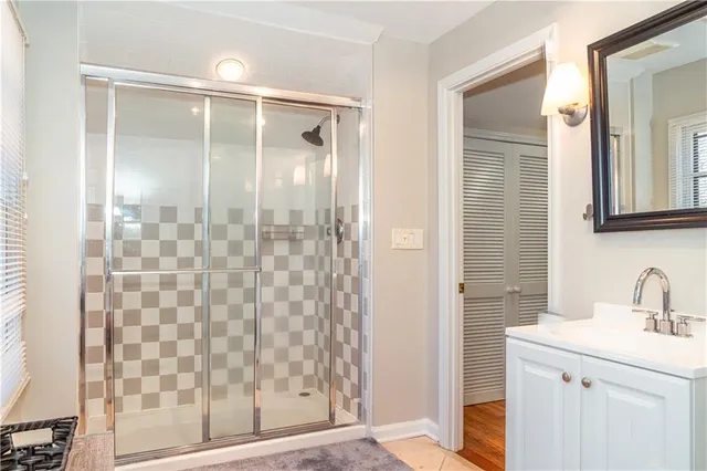 a bathroom with a shower and a sink