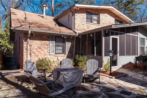 a front view of house with outdoor seating