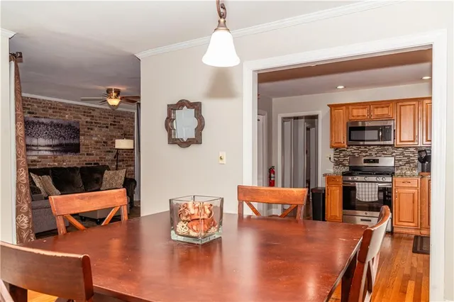a living room with furniture and a kitchen area