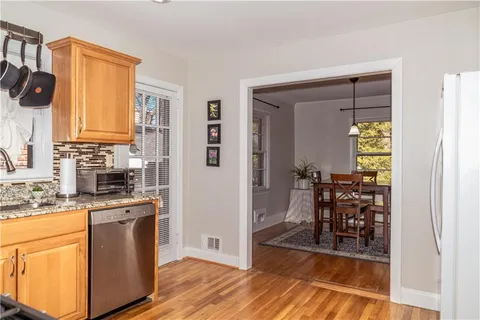 a view of a kitchen from the hallway
