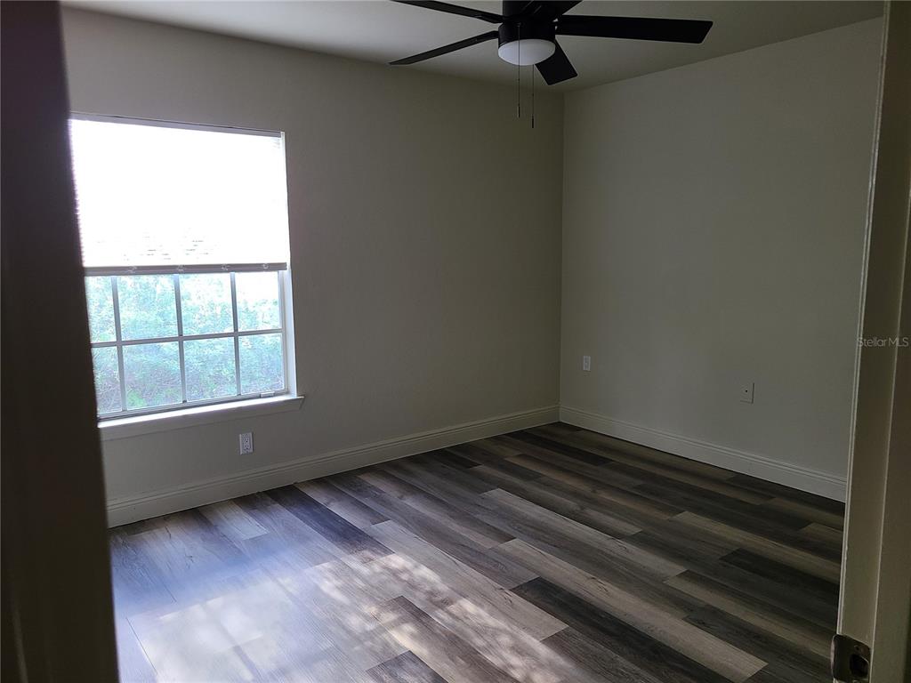 8911 Manor Loop, Unit 205 Lakewood Ranch, FL 34202 - Photo 25 of 33 a view of an empty room with a window